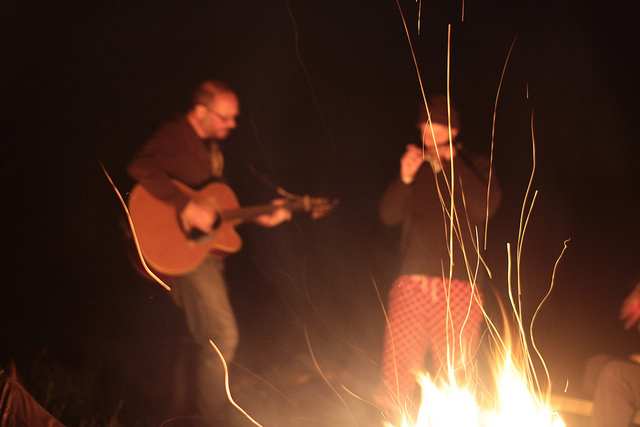 Two ageing rockers playing by an open fire