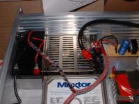 Image of power supply and battery installed in box.
